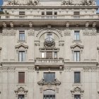 Baroque-style building facade with sculptural details, balconies, and windows