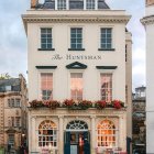 European-style Building with Café & Outdoor Seating on Cobblestone Street