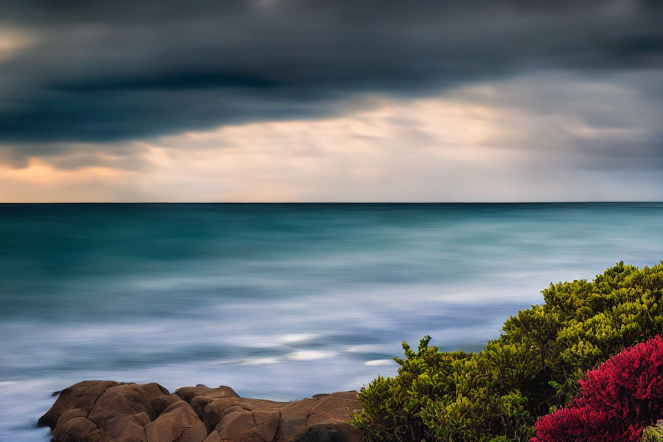 Tranquil seascape with dramatic sky and rocky coastline