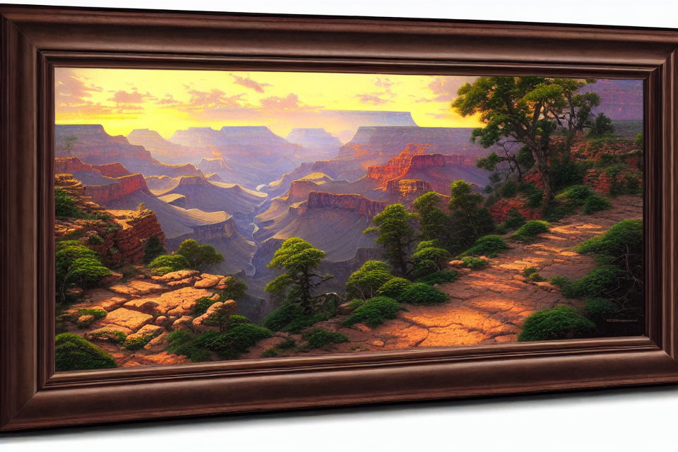 Framed painting of canyon at sunset with river and red rock formations