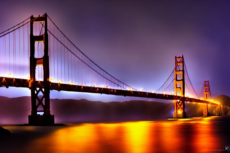 Iconic Golden Gate Bridge illuminated at dusk with purple sky