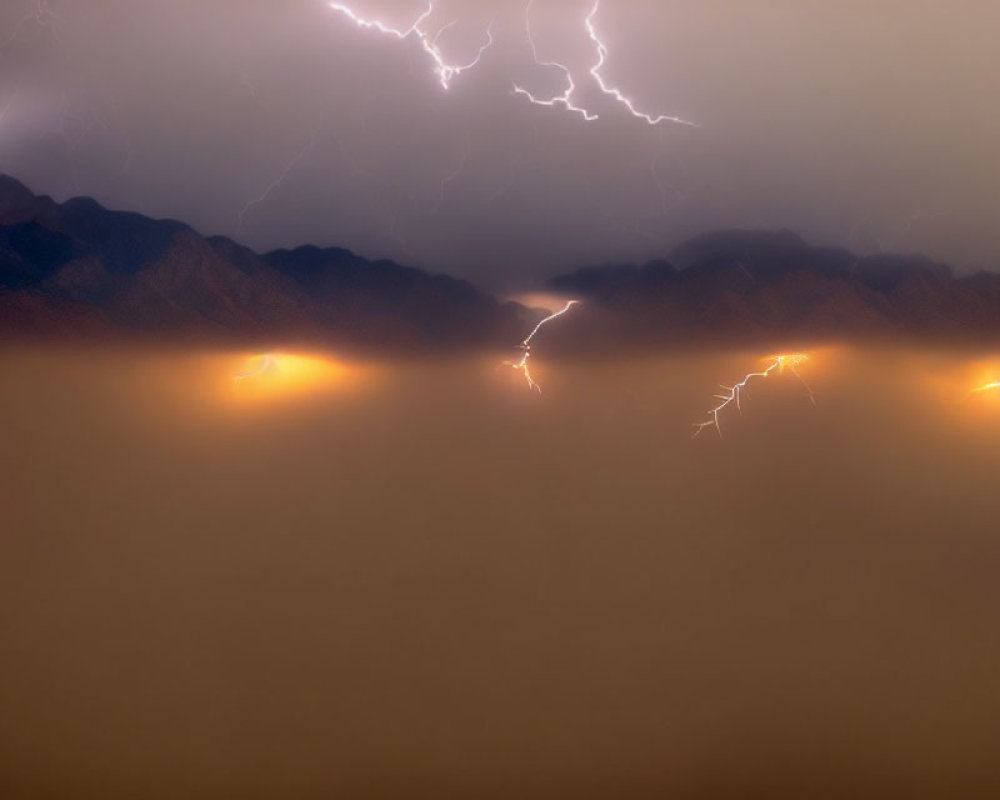 Stormy Sky Over Mountain Range with Lightning Strikes and Wildfires Below