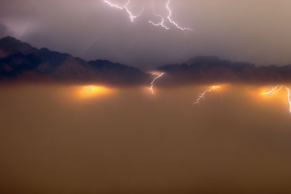 Stormy Sky Over Mountain Range with Lightning Strikes and Wildfires Below