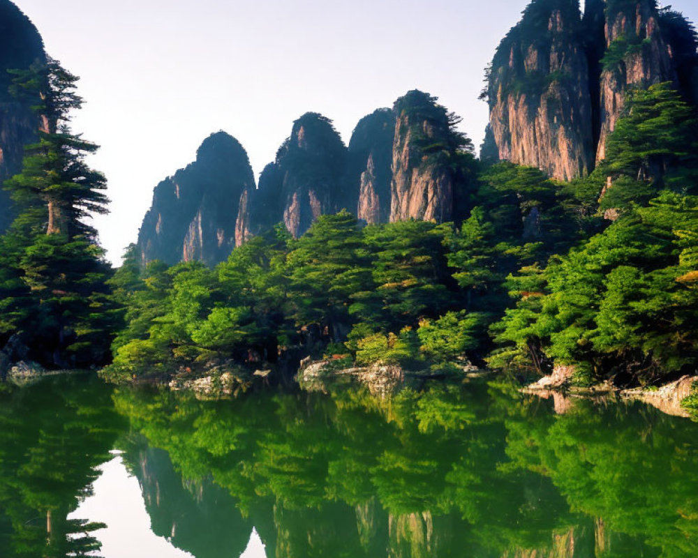 Jagged mountains reflected in serene lake amidst lush greenery