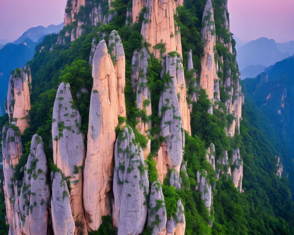 Majestic verdant peaks against pink dusk sky