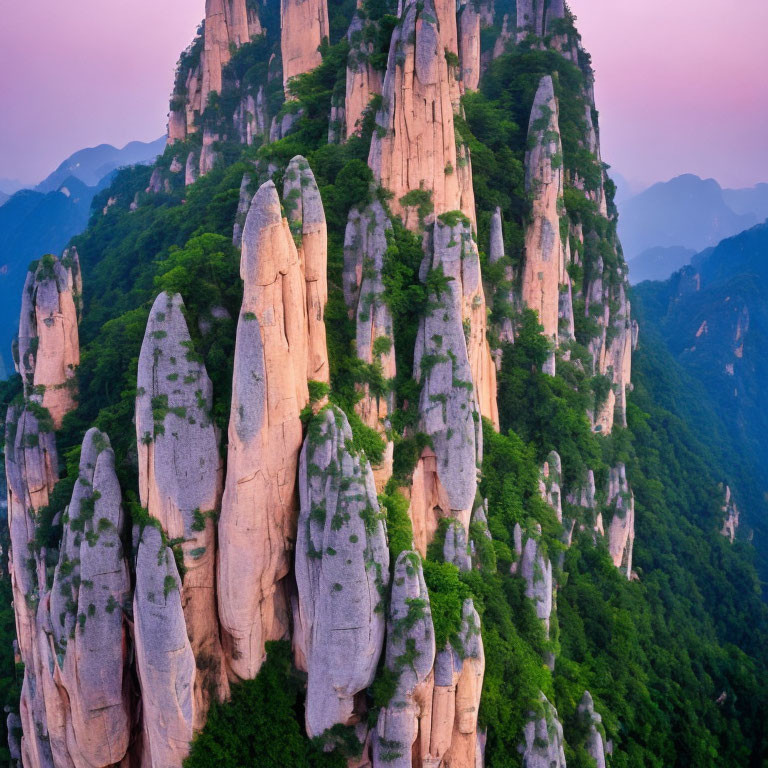 Majestic verdant peaks against pink dusk sky