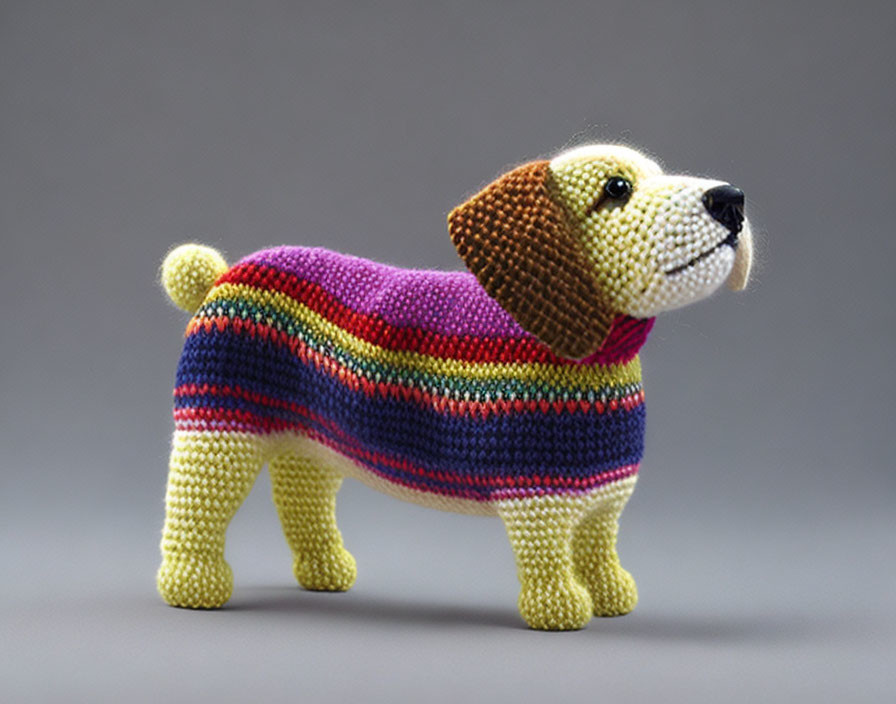 Multicolored Crocheted Dog Figurine on Grey Background