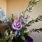 Soft-focus photograph of white and pink bouquet with vibrant pink bloom.