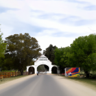 Colorful street scene with people, animals, trees, and archway in sunlight