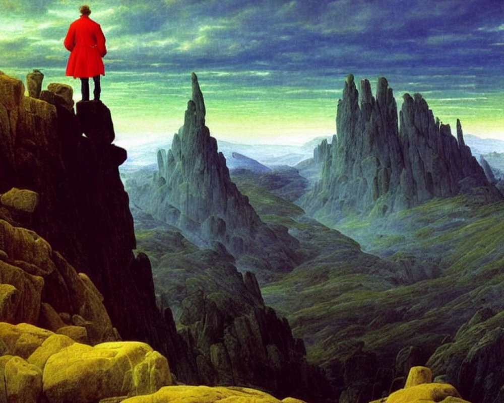 Person in Red Cloak Standing on Rocky Ledge Overlooking Vast Green Landscape