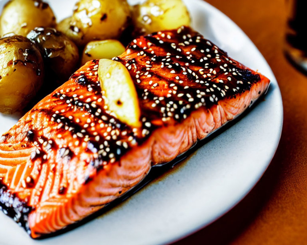 Sesame Glazed Grilled Salmon with Roasted Potatoes on White Plate