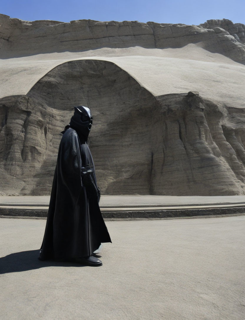 Person in Darth Vader costume at sandstone archway on sunny day