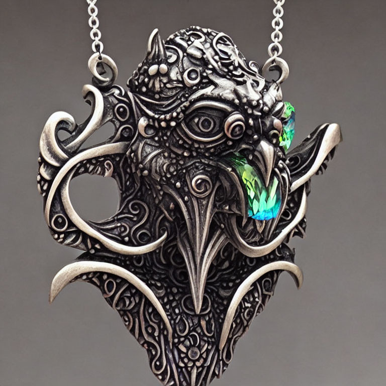 Silver Dragon Pendant with Green Gemstone on Gray Background