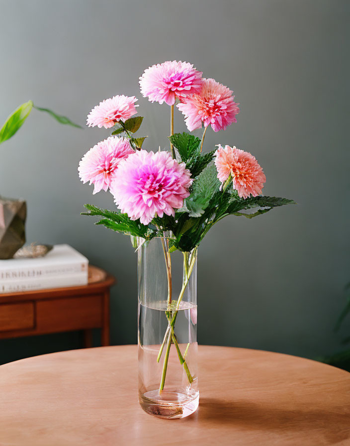 Pink Dahlia Bouquet in Gradient Colors in Clear Glass Vase on Wooden Table