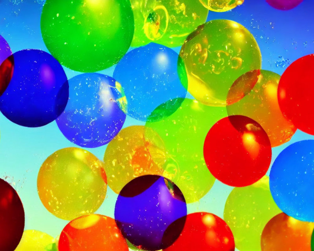 Colorful balloons in bright sky with light flares & reflections.