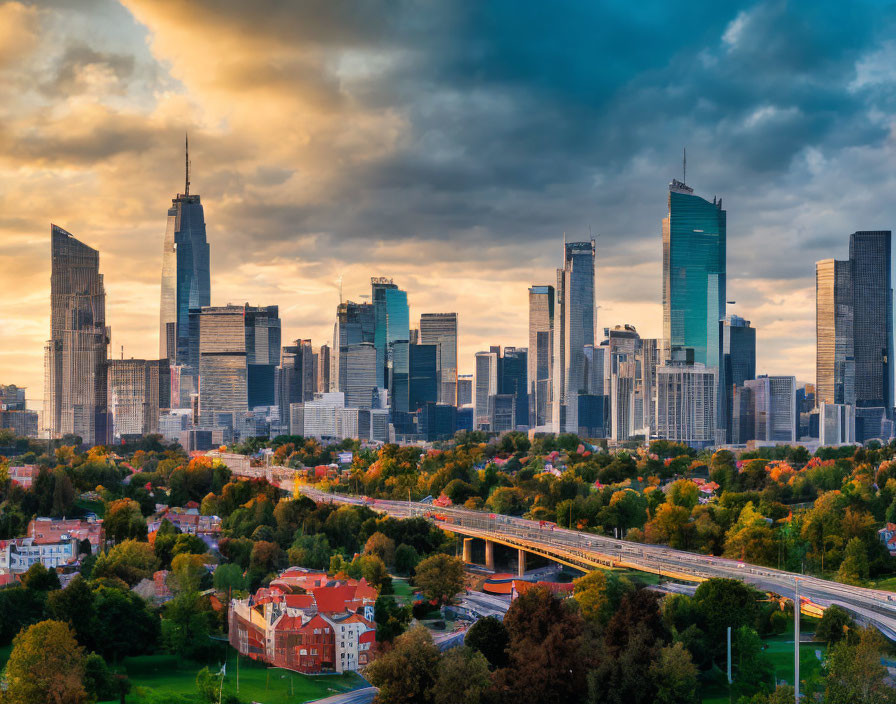 City skyline at sunset with skyscrapers, green park, and vibrant clouds