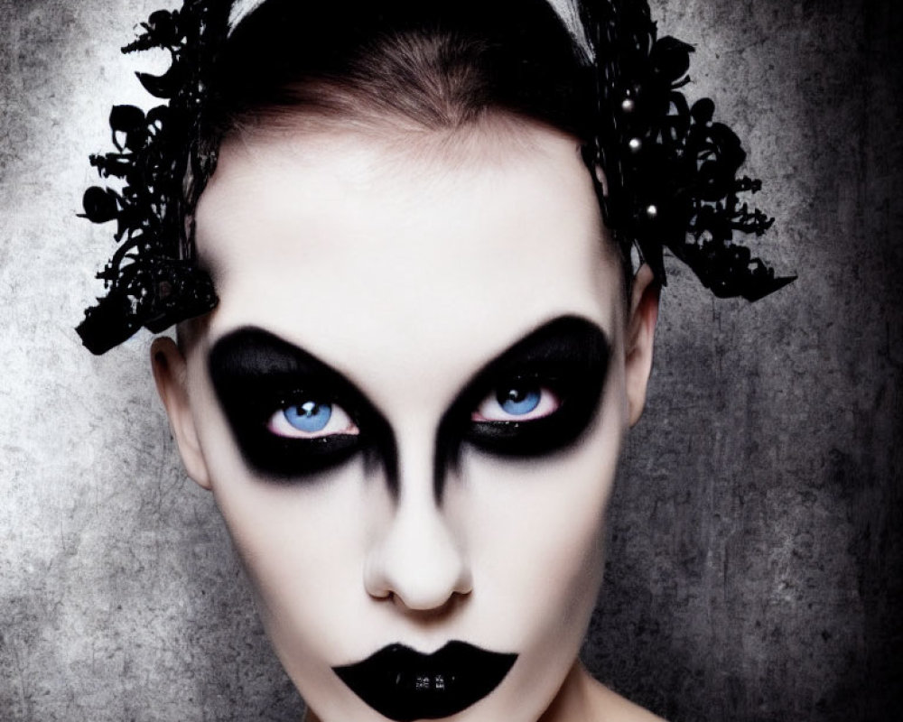 Dramatic black and white gothic makeup with intense eye shadow