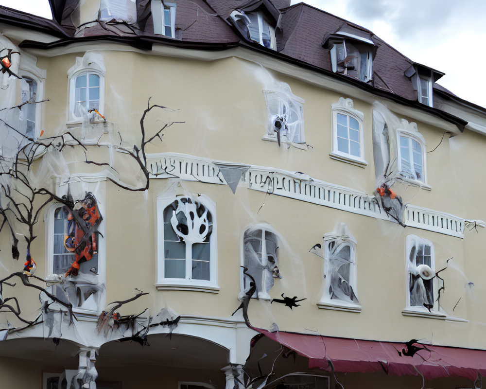 Spooky Halloween-themed decorations on cream-colored house