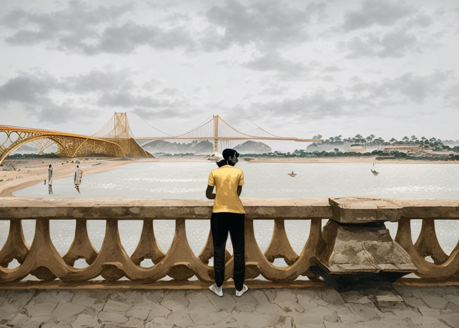 Person in yellow shirt and hat by river with bridge and cloudy sky