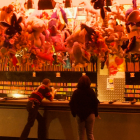 Warmly lit bar scene with patrons enjoying drinks and bread, bartender serving customers