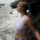 Colorful-haired woman in pirate hat with jewelry in misty setting