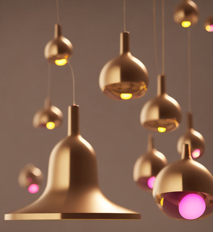 Golden Pendant Lights with Pink Orbs on Neutral Background