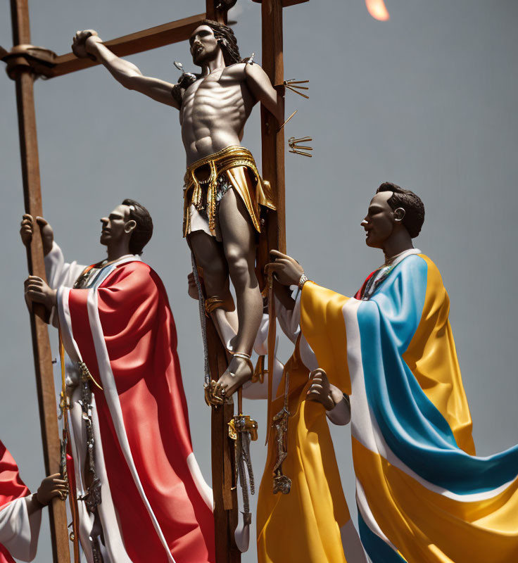 Religious statues of crucifixion with two figures against clear sky