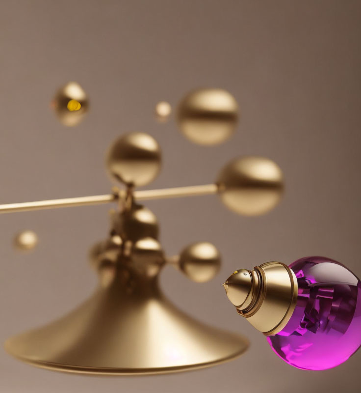 Golden Mobile Sculpture with Spherical Elements and Purple Glass Perfume Bottle