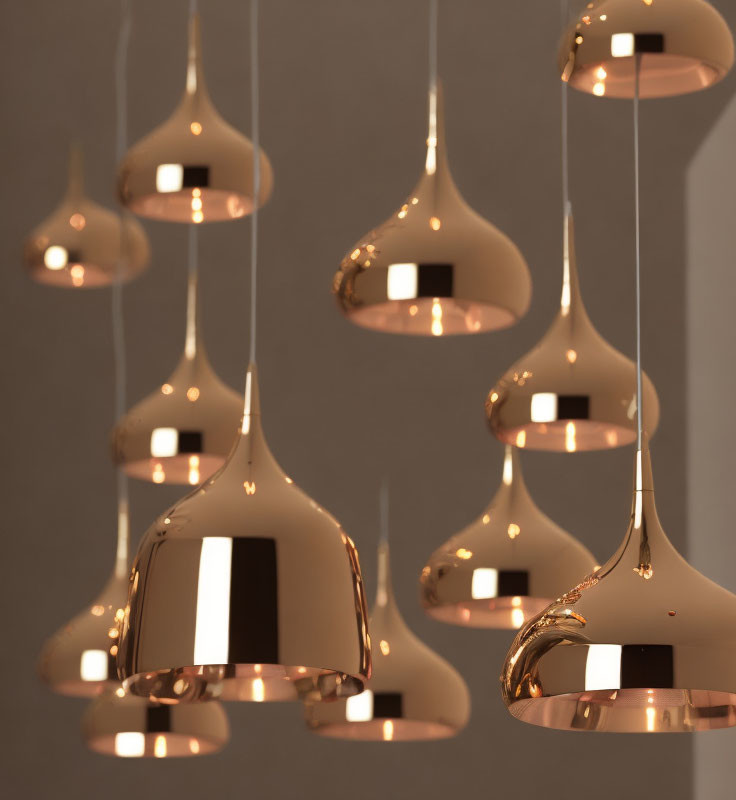 Sleek Copper Pendant Lights with Organic Shape on Neutral Background