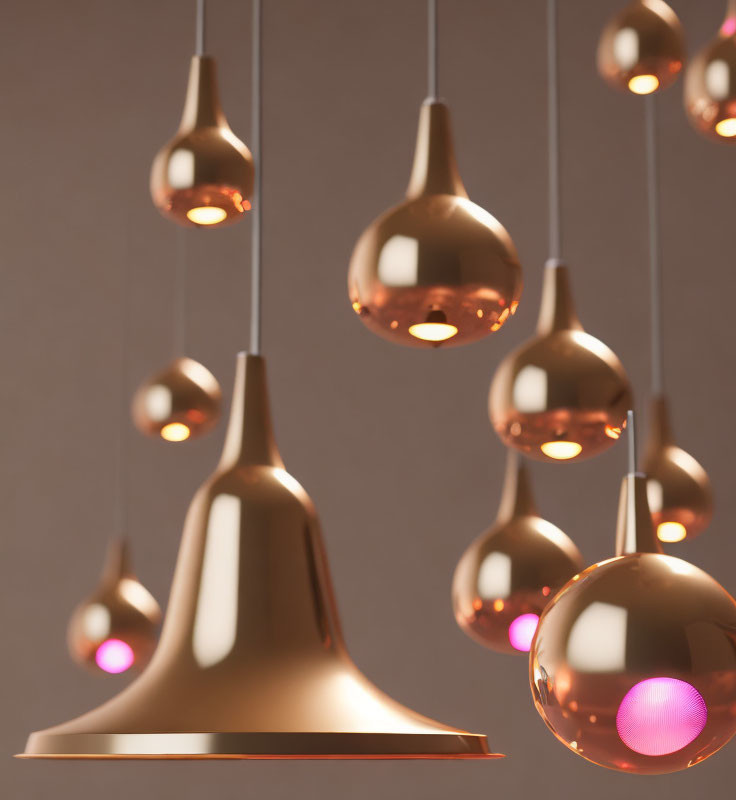 Modern interior featuring rose gold pendant lamps in various shapes on a neutral background