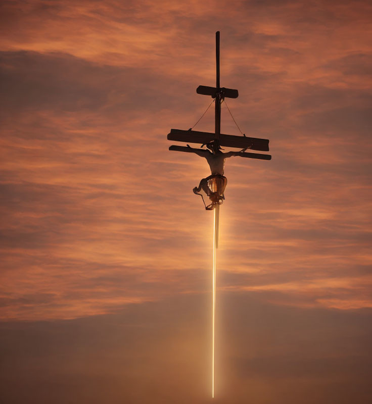 Airplane with contrail in orange-tinted sunset sky