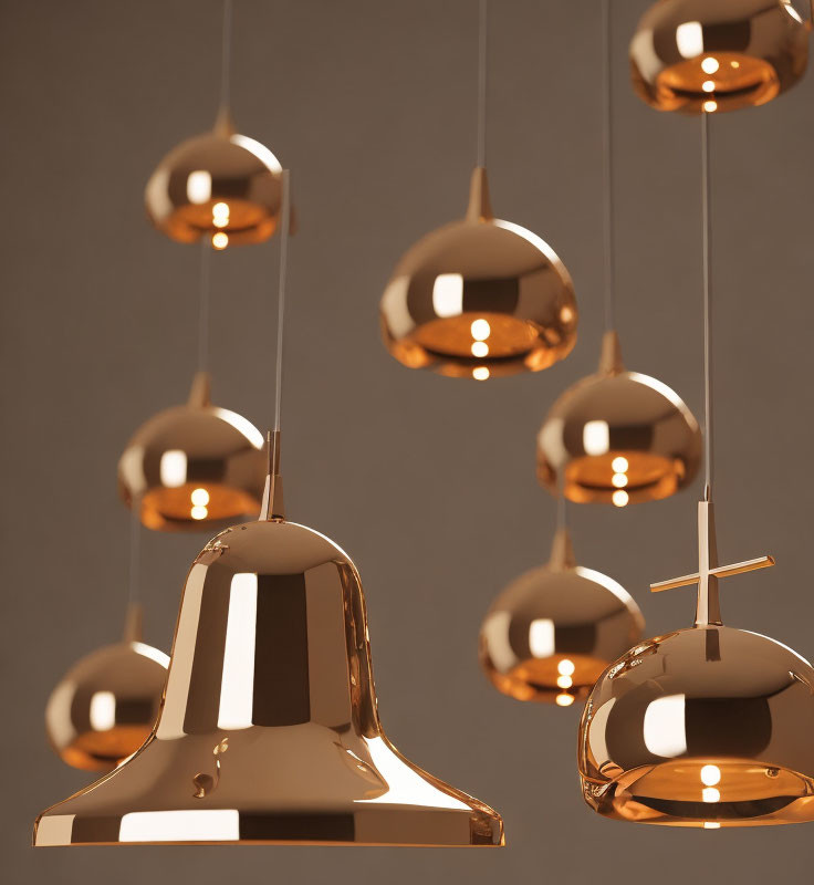 Various Shapes Copper Pendant Lights Emitting Warm Glow on Neutral Background