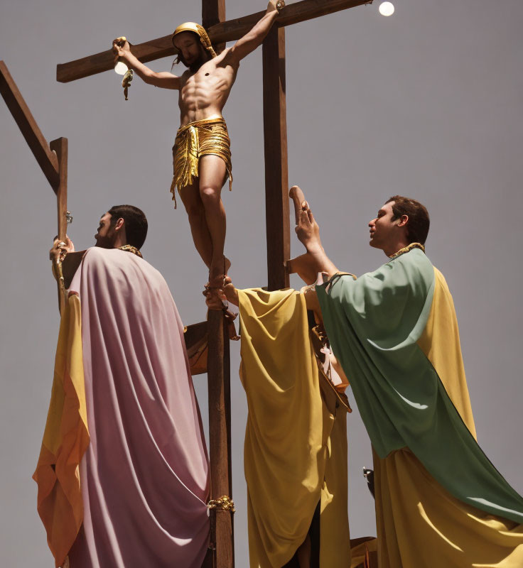 Men on platform reach crucifix with Jesus figure under solemn sky