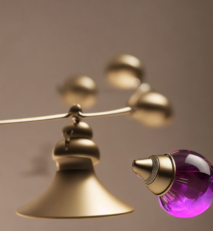 Golden balance scale with brass bell and purple glass perfume bottle