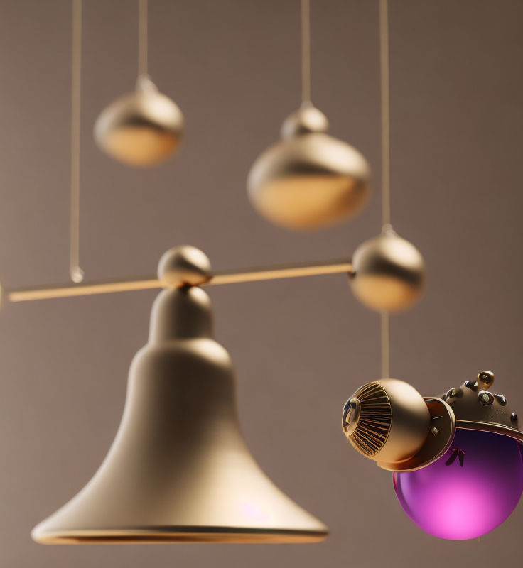 Metallic Spheres Balance Mobile Sculpture in Gold and Purple on Beige Background