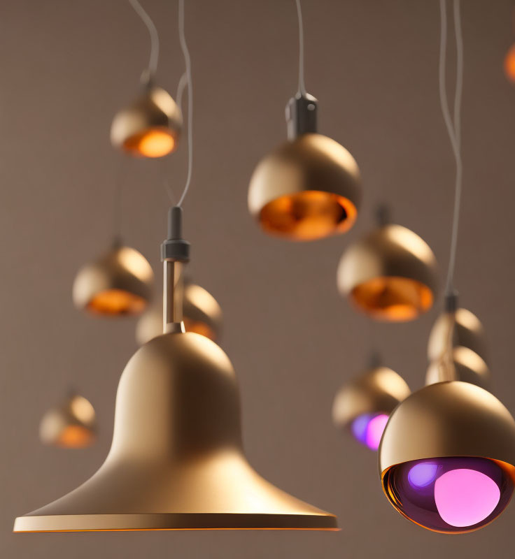 Matte Gold Pendant Lights Hanging at Various Heights on Neutral Background