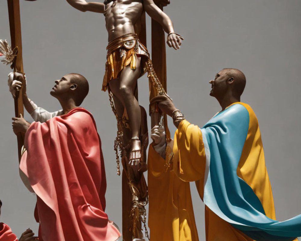 Religious statue of Jesus on the cross with two figures in colorful robes