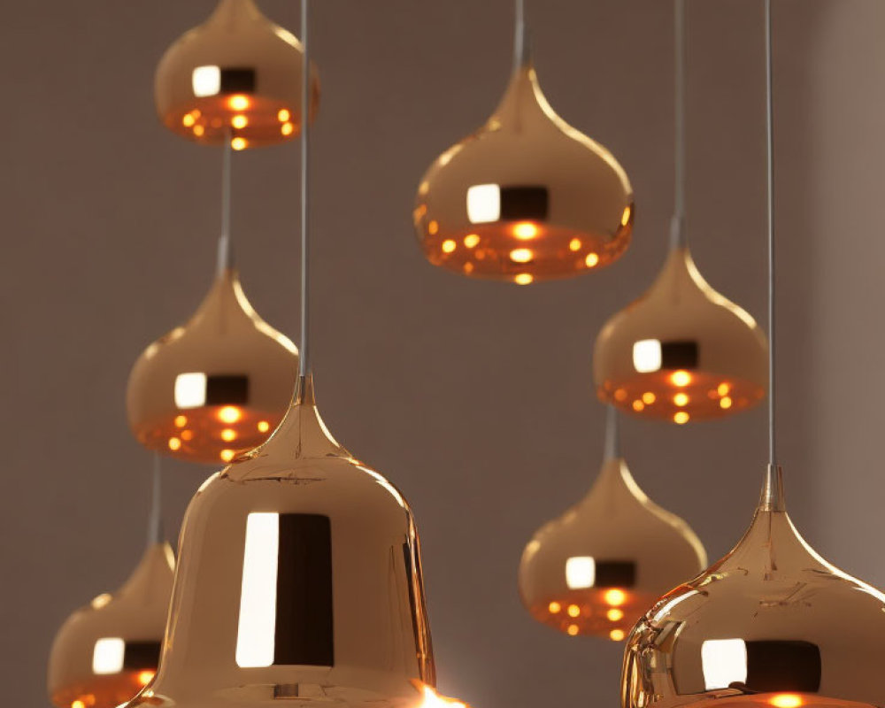 Warm Glowing Copper Pendant Lights Suspended Against Neutral Backdrop