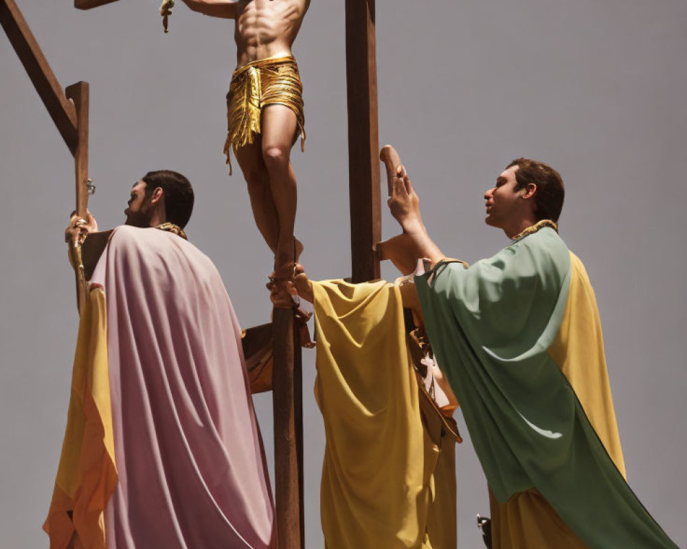 Men on platform reach crucifix with Jesus figure under solemn sky