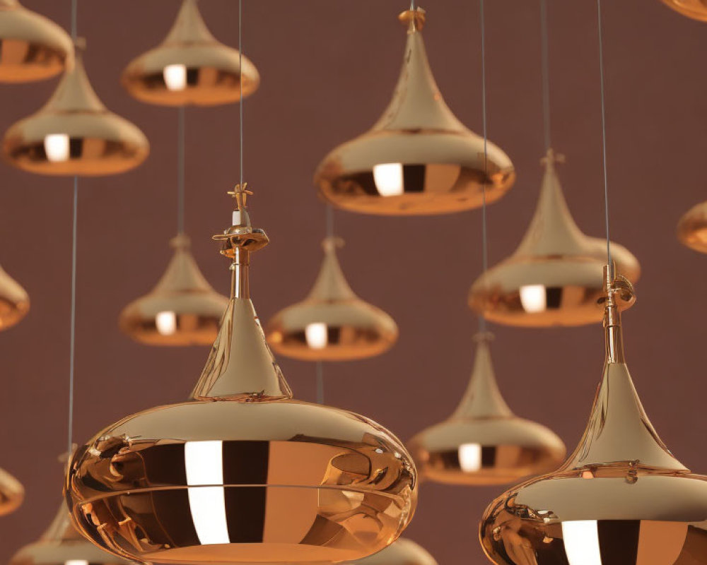 Golden Pendant Lights with Modern Design on Warm Brown Background