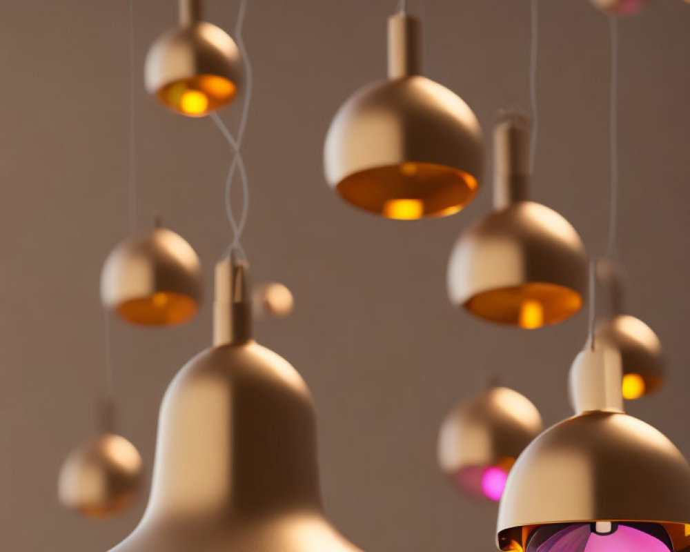 Matte Gold Pendant Lights Against Neutral Background