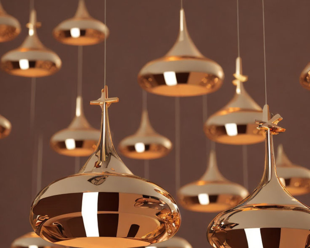 Reflective Copper Pendant Lights in Varied Heights Illuminate Warm Interior