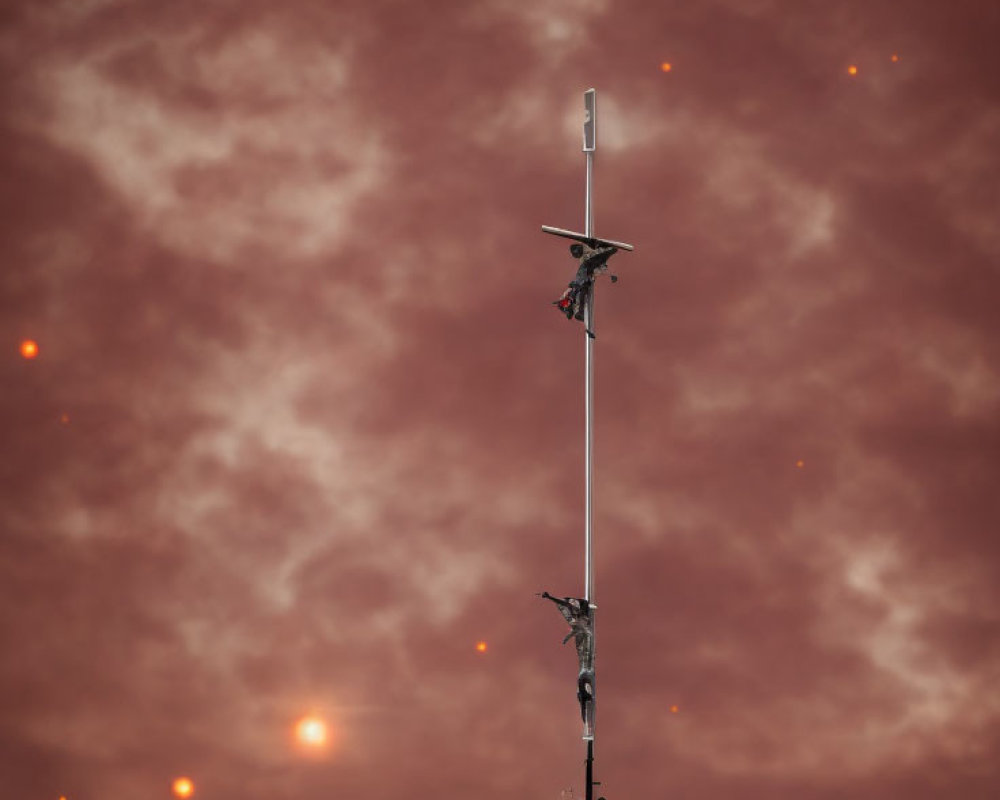 Vertical Antenna with Multiple Transceivers Against Red Cloudy Sky