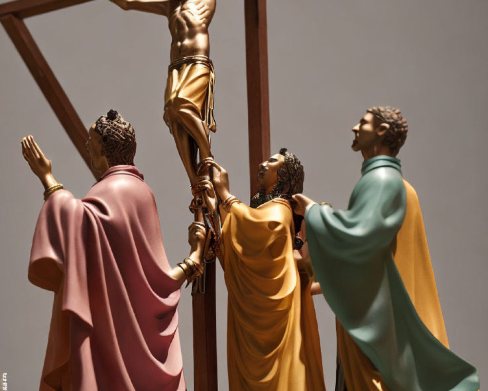 Biblical attire statues holding crucifix with Jesus figure