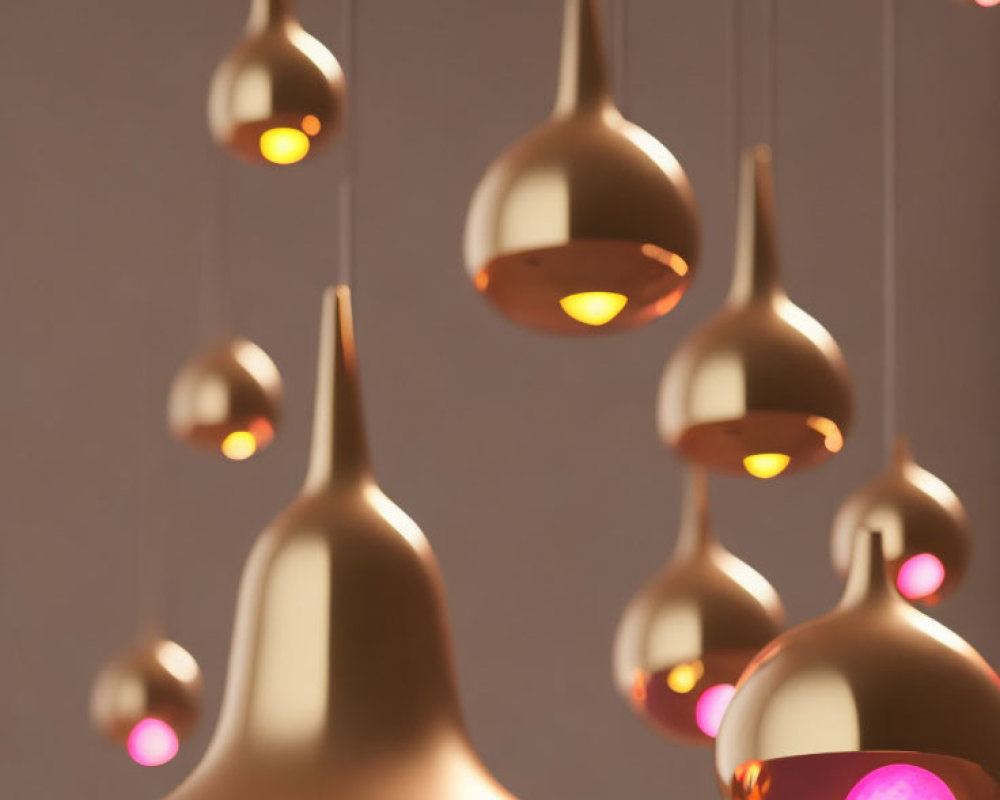 Sleek Golden Pendant Lights Suspended at Varying Lengths