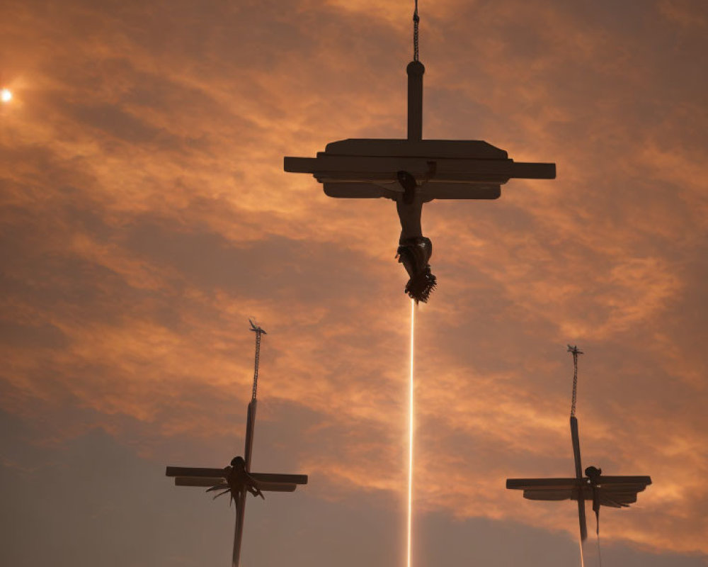 Silhouetted figures on three crosses under dramatic sky