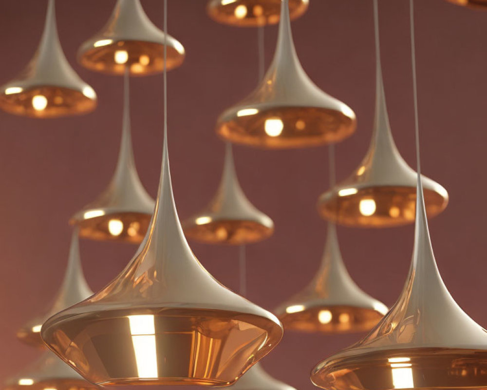 Inverted trumpet-like pendant lights on soft red background