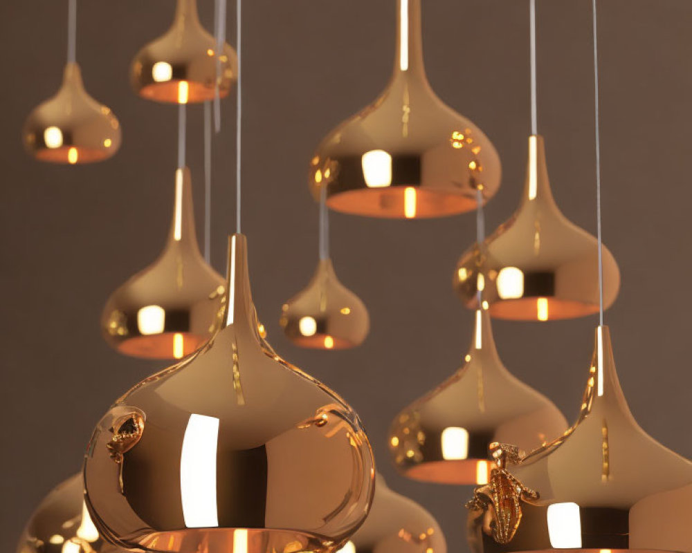 Sleek Modern Golden Pendant Lights on Varying Heights