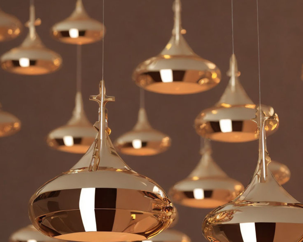 Reflective modern copper pendant lights on soft brown background