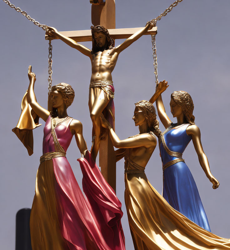 Three robed figures around crucified individual sculpture.